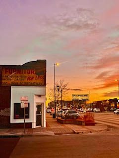 street with businesses at sunset